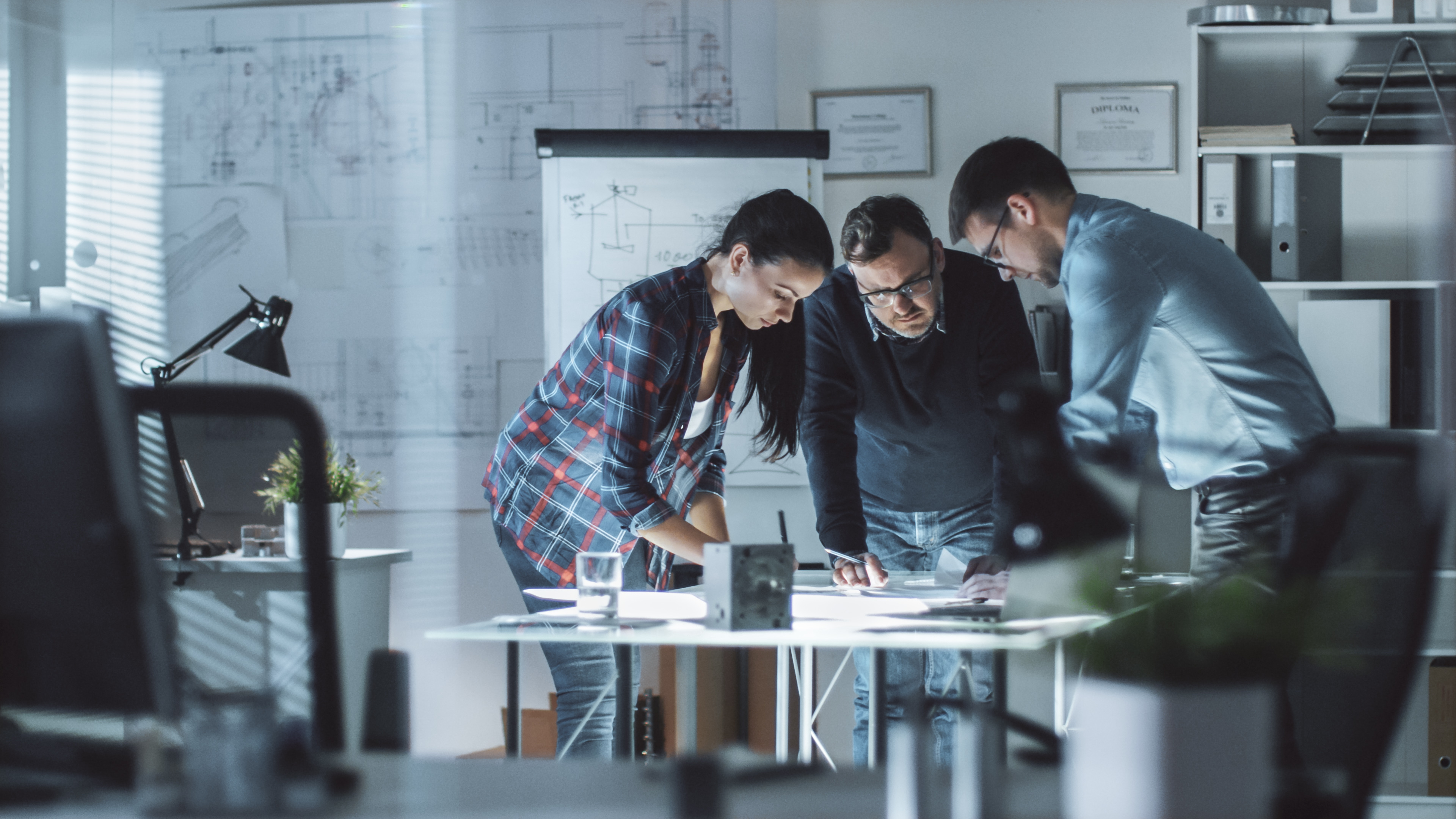 Professional team working on architectural plans